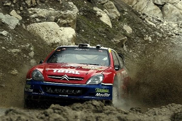 FIA World Rally Championship: Fourth placed Colin McRae with co-driver Derek Ringer Citroen Xsara WRC powers out of a watersplash on Stage 17