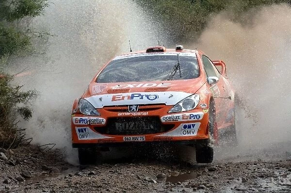 FIA World Rally Championship: Henning Solberg, Peugeot 307 WRC, leaps out of the watersplash on Stage 6