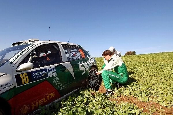 FIA World Rally Championship: Jan Kopecky surveys the damage to his Skoda Fabia WRC on Stage 16