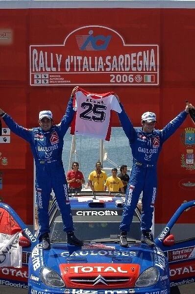 FIA World Rally Championship: L-R: Co-driver Daniel Elena celebrates his 25th co-driving victory with Sebastien Loeb on the podium