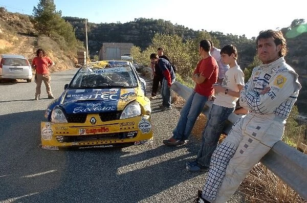 FIA World Rally Championship: Luca Betti stands next to his JWRC Renault Clio which he rolled on stage 12