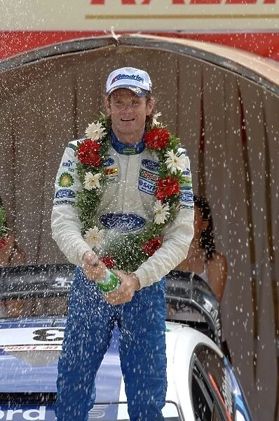 FIA World Rally Championship: Marcus Gronholm, Ford, sprays the winners champagne on the podium in Kemer