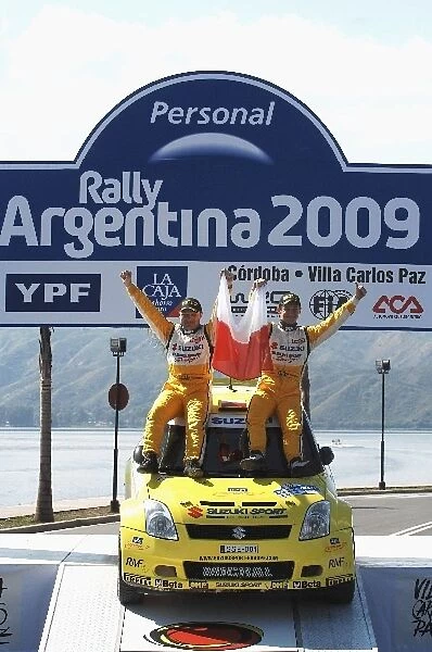 FIA World Rally Championship: Michal Kosciuzko Suzuki on the podium