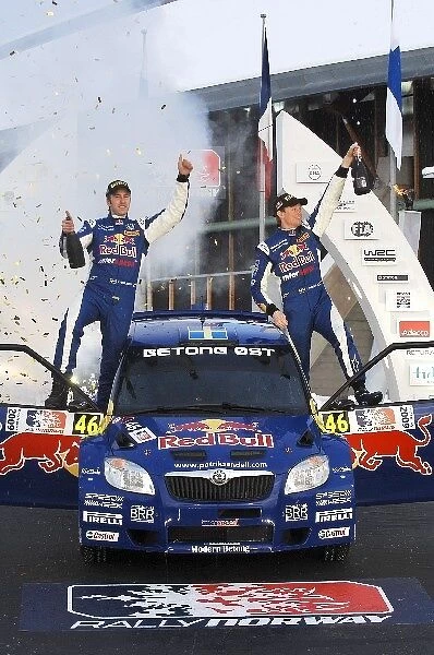 FIA World Rally Championship: Patrik Sandell Skoda wins the Production category in an S2000 car and sprays the champagne
