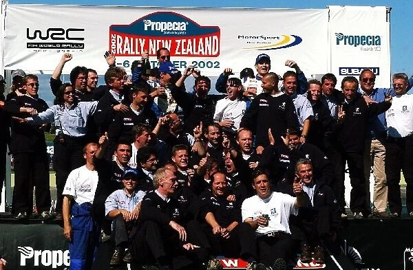 FIA World Rally Championship: The whole Peugeot Team celebrate Marcus Gronholms rally win and his second WR Championship