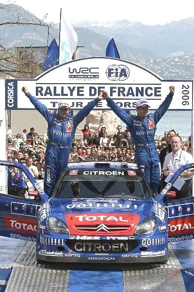 FIA World Rally Championship: R-L: Sebastien Loeb and co-driver Daniel Elena, Citroen, celebrate victory on the podium