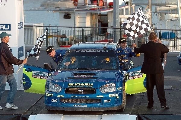 FIA World Rally Championship: Rally New Zealand winners Petter Solberg, right, and co-driver Michael Park, left, celebrate after winning Rally