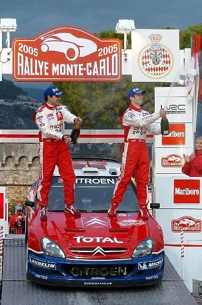 FIA World Rally Championship: Rally winners Sebastien Loeb with co-driver Daniel Elena Citroen Xsara WRC celebrates on the podium