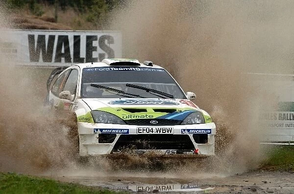 FIA World Rally Championship: Roman Kresta, Ford Focus RS WRC, through the watersplash on Stage 15