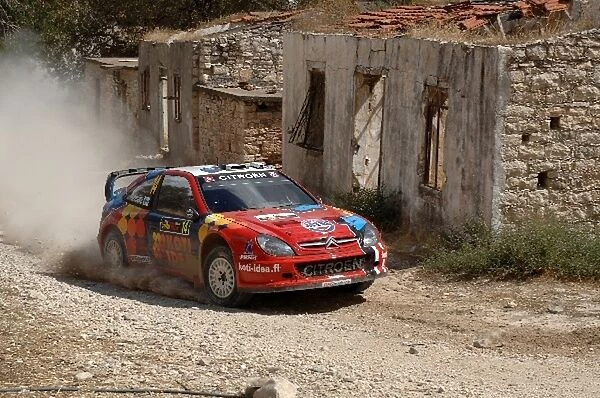 FIA World Rally Championship: Toni Gardemeister on Stage 11 through the abandoned village of Vretsia