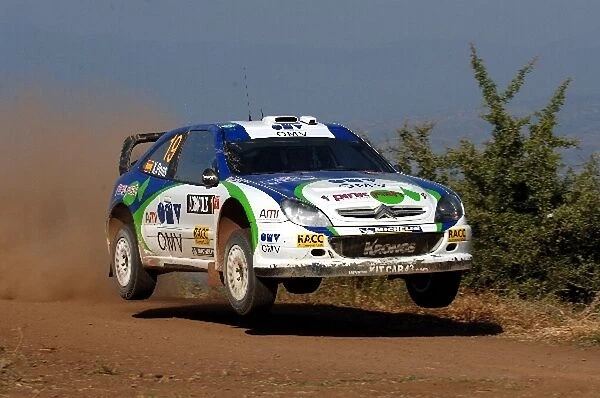 FIA World Rally Championship: Xavier Pons, Citroen Xsara WRC, jumps on Stage 17