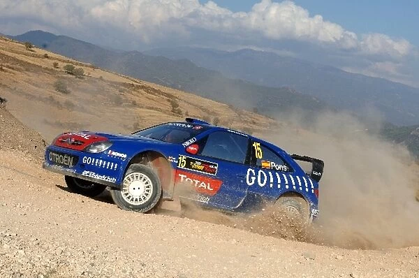 FIA World Rally Championship: Xavier Pons in action on Stage 15