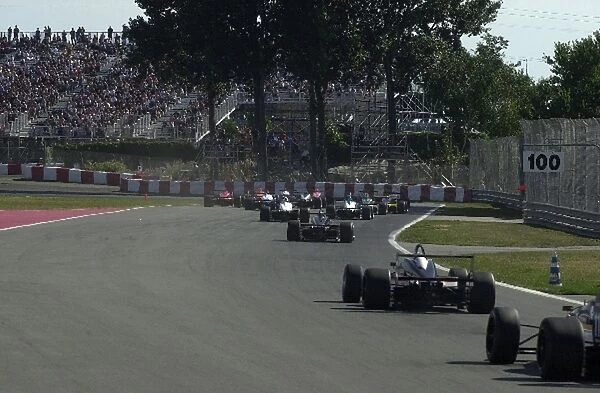 The field barrels into turn one at the Toyota Atlantic race at the Molson Indy Montreal