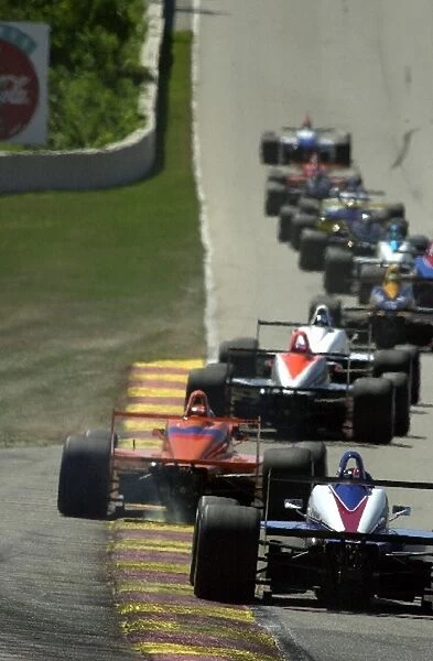 The field complete a lap: Toyota Atlantic Championship, Road America, Elkhart Lake, Wisconsin, 18 August 2002