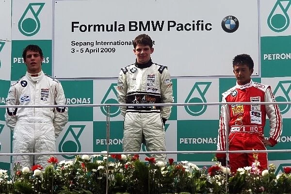 Formula BMW Pacific: The podium: Chris Wootton Eurasia Motorsport, second; Gary Thompson Team E-Rain, race winner; Rio Haryanto Meritus, third