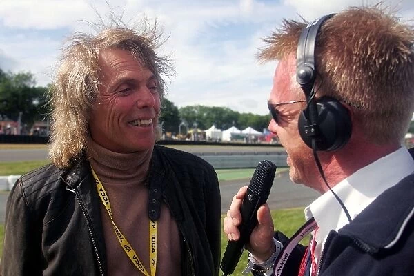 Formula BMW UK Championship: Track commentator Alan Hyde talks with Scott Gorham, guitarist from Thin Lizzy who was a guest of BMW