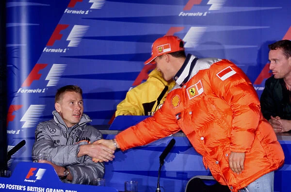 Formula One British Grand Prix Mika Hakkinen greets championship leader Michael