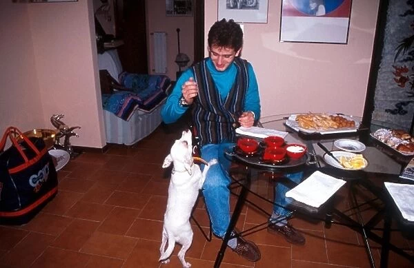 Formula One Drivers at Home Feature: Jarno Trulli at home teasing his pet dog as dinner is about to be served