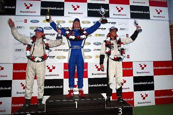 Formula Ford Festival: Charlie Donnelly 2nd, Duncan Tappy 1st, Dennis Retra 3rd celebrate on the podium