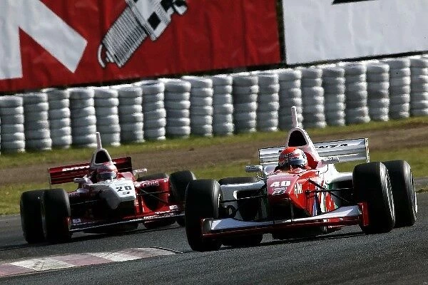 Formula Nippon Championship: Race winner Richard Lyons DoCoMo Dandelion leads Yuji Ide Impul Racing