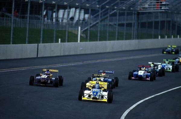 Formula Renault Winter Series: Julien Piguet leads the field around the Rockingham banking at the start of the race