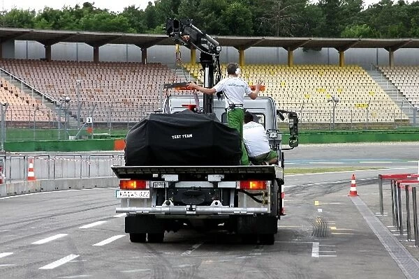 Formula One Testing: Alex Wurz Honda RA108 is brought back to the pits on a truck
