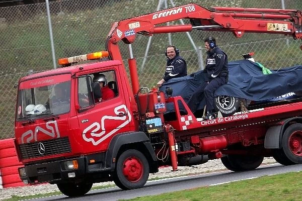 Formula One Testing: The BMW Sauber of Nick Heidfeld is taken back to the pits