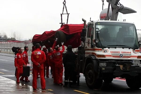 Formula One Testing: The car of Felipe Massa Ferrari F2008 is returned to the pits on a truck after going off