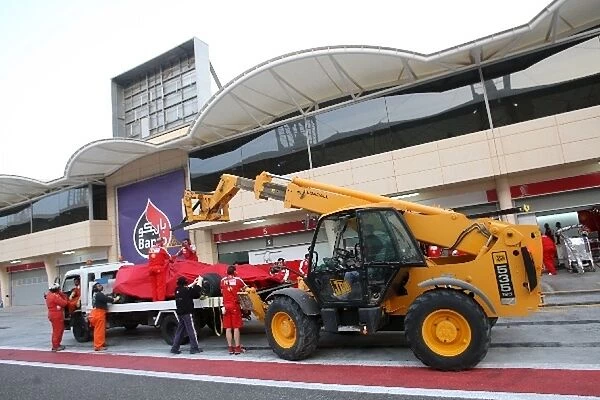 Formula One Testing: The car of Felipe Massa Ferrari F60 is brought back to the pits on a truck