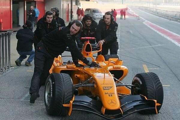 Formula One Testing: The car of Gary Paffett McLaren Mercedes MP4  /  20 is pushed back into the pitlane after just one installation lap