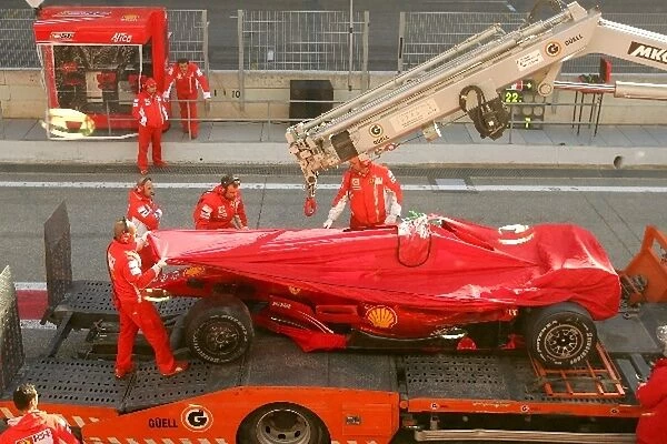 Formula One Testing: The car of Luca Badoer Ferrari Test Driver is brought back to the pits after crashing