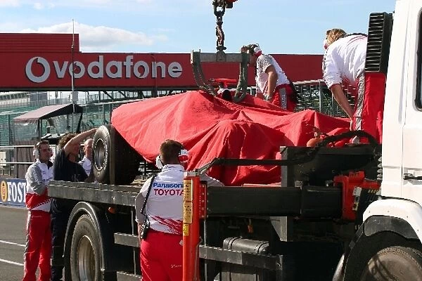 Formula One Testing: The car of Ralf Schumacher Toyota TF105 is brought back to the pits on a truck