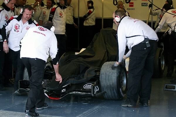 Formula One Testing: The car of Rubens Barrichello Honda F1 Racing in the garage after going into the gravel trap