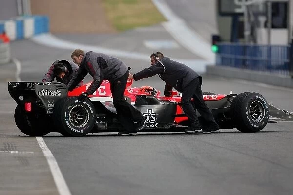 Formula One Testing: Christijan Albers MF1 Toyota M16 is pushed back into his pit garage