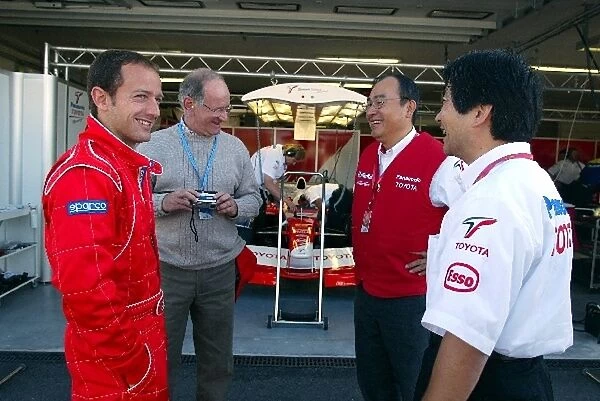 Formula One Testing: Cristiano Da Matta talks with Toyota engineers and his father before he makes his first F1 test with Toyota