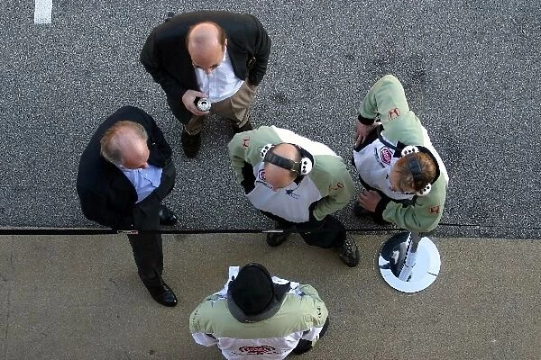 Formula One Testing: David Richards BAR Team Principal in conference with members of the BAR team in the pit lane