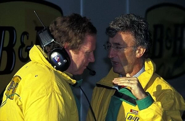 Formula One Testing: Eddie Jordan Jordan Team Principal talks with a Jordan team member