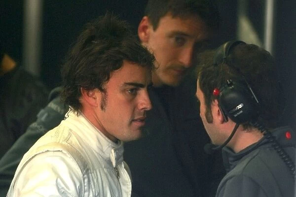 Formula One Testing: Fernando Alonso, chats to his engineers at McLaren