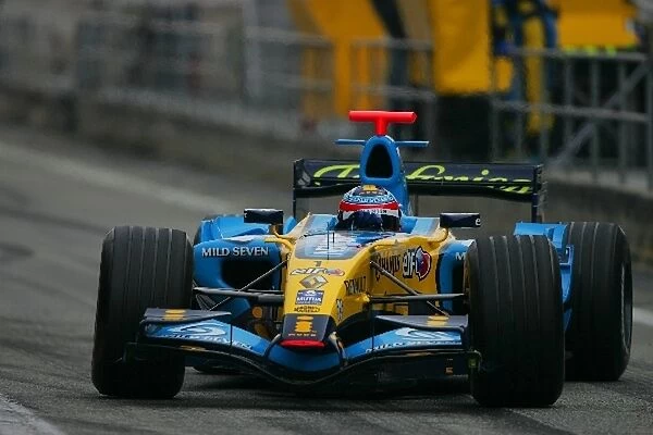 Formula One Testing: Fernando Alonso Renault R26 gets sideways in the pitlane