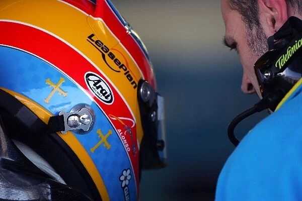 Formula One Testing: Fernando Alonso Renault talks to an engineer