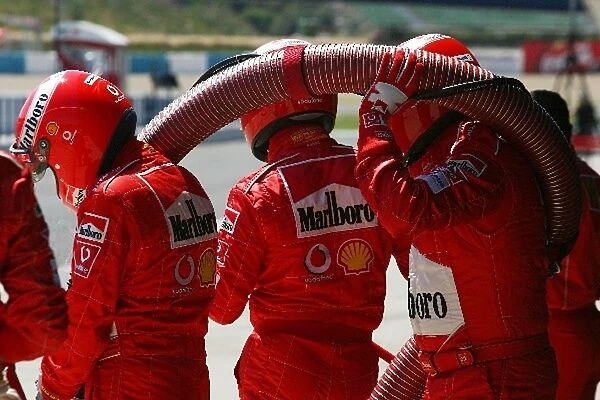Formula One Testing: The Ferrari mechanics get ready to refuel Rubens Barrichello Ferrari F2004
