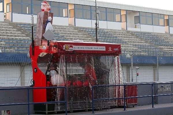 Formula One Testing: The Ferrari pit wall gantry is decorated for Christmas
