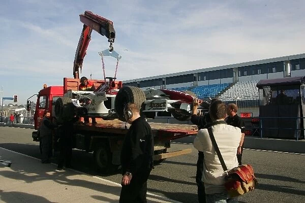 Formula One Testing: Giancarlo Fisichellas Force India car is brought back to the pits after he spun