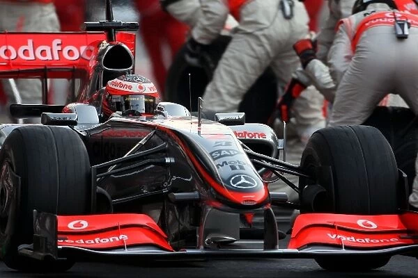 Formula One Testing: Heikki Kovalainen Mclaren MP4-24 makes a pitstop