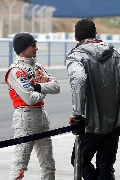 Formula One Testing: Heikki Kovalainen McLaren talks with Mark Webber Red Bull Racing