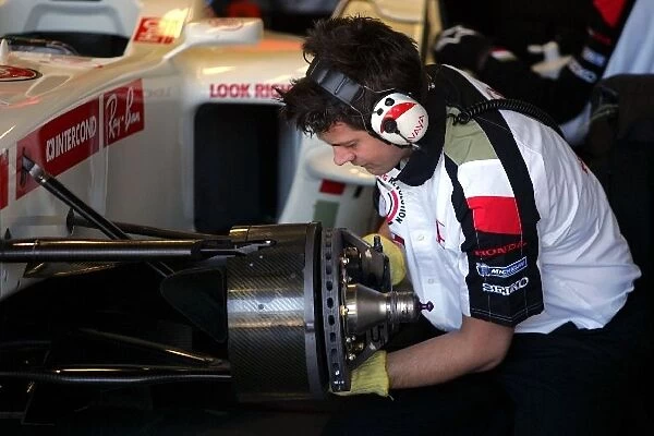 Formula One Testing: A Honda Racing F1 Team mechanic hard at work