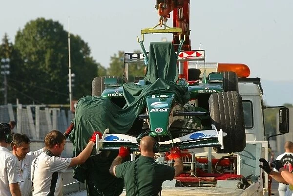Formula One Testing: A Jaguar is returned to the pits on a truck after causing a red flag during testing