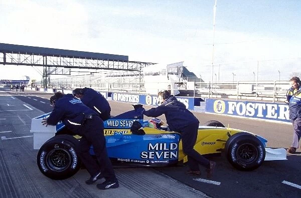 Formula One Testing: Jarno Trulli Renault R202 is pulled back into the pit garage