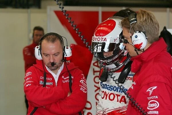 Formula One Testing: Jarno Trulli, Toyota, centre, talks with Mike Gascoyne, Toyota Chassis Technical Director, left, and Ossi Oikarinen Toyota