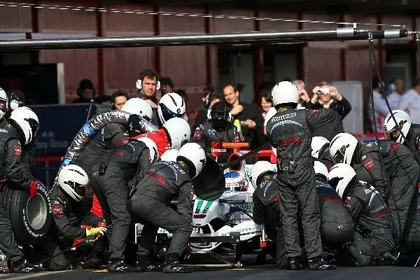 Formula One Testing: Jenson Button Honda RA108 makes a pit stop
